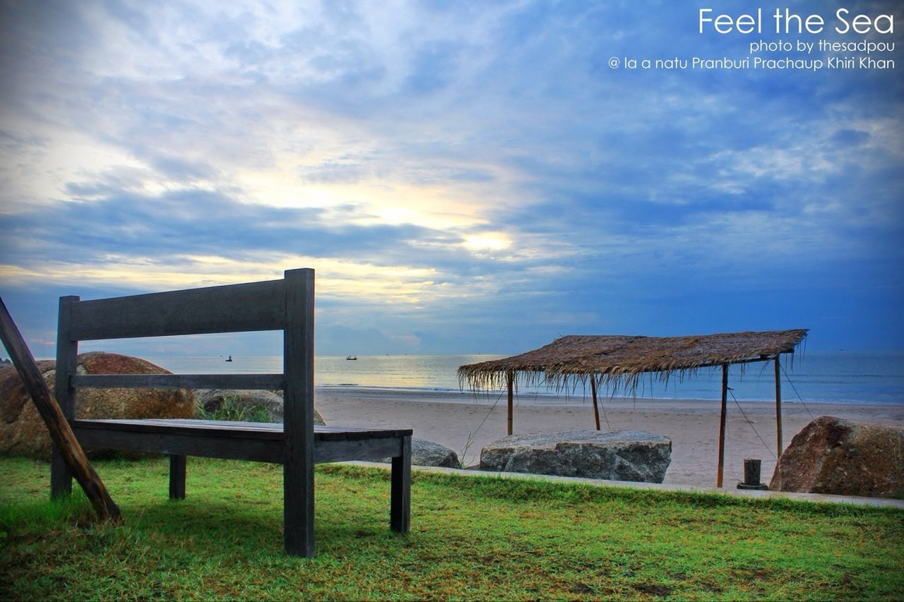 sky, sea, cloud - sky, beach, tranquility, water, tranquil scene, horizon over water, cloud, empty, nature, scenics, cloudy, absence, grass, bench, sand, wood - material, shore, built structure