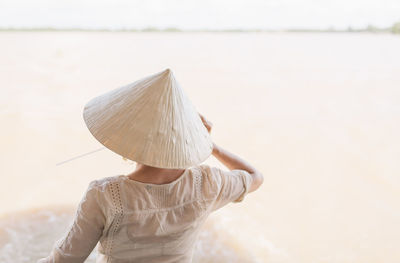 Rear view of woman wearing conical hat