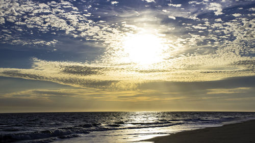 Scenic view of sea against sky at sunset