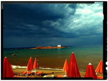 Scenic view of sea against cloudy sky