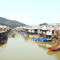 Boats moored at harbor