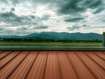 Scenic view of mountains against cloudy sky