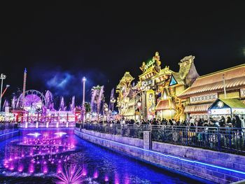 Illuminated buildings in city at night