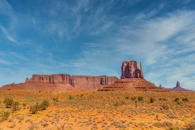 View of rock formations on landscape against sky