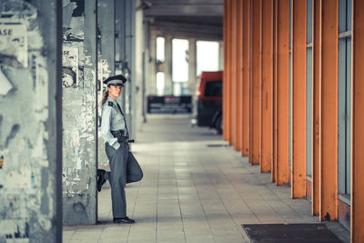 Side view of man in corridor of building