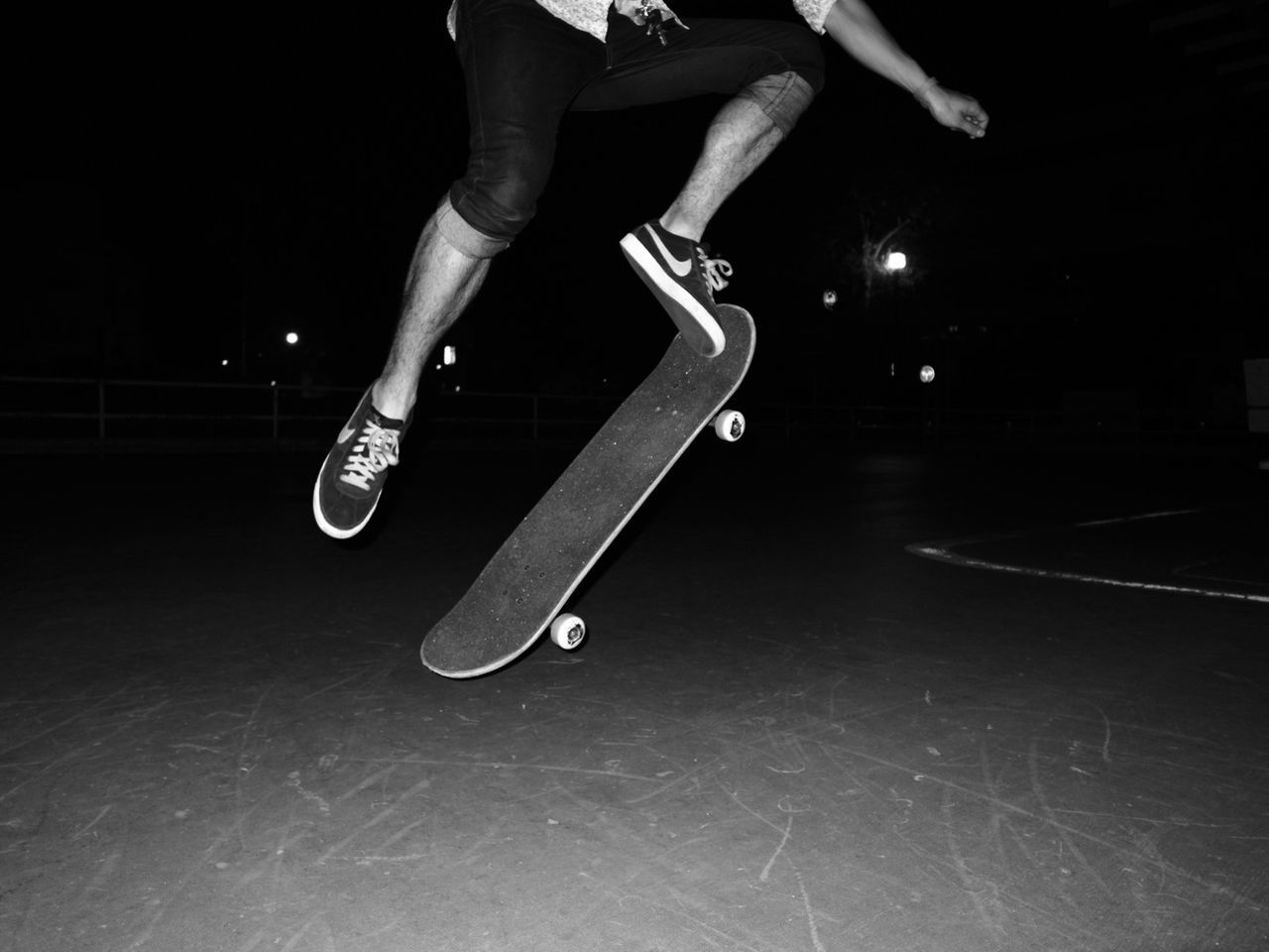 low section, person, lifestyles, men, leisure activity, shoe, indoors, night, footwear, standing, skateboard, skateboarding, skill, human foot, casual clothing, motion