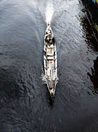 High angle view of man sailing boat on river