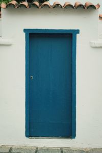 Closed blue door of building