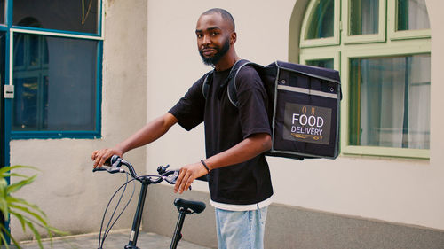 Young man riding bicycle