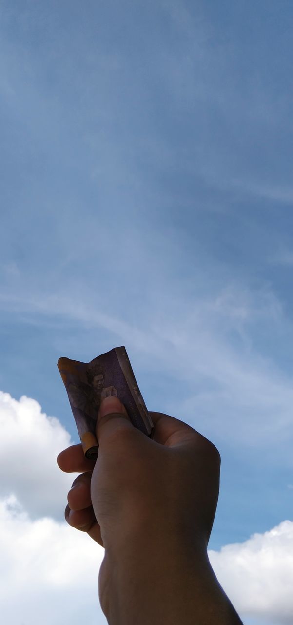 LOW ANGLE VIEW OF HUMAN HAND AGAINST SKY