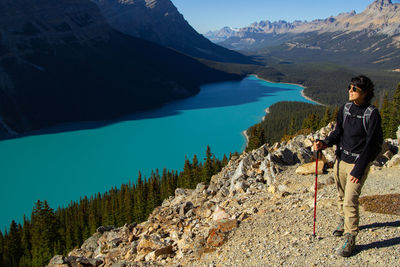 Rear view of woman walking on mountain