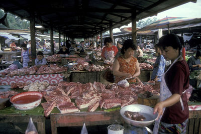 People at market stall