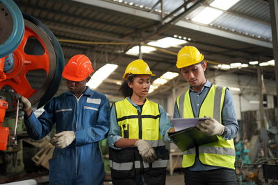 Portrait of male worker standing in the heavy industry manufacturing factory.