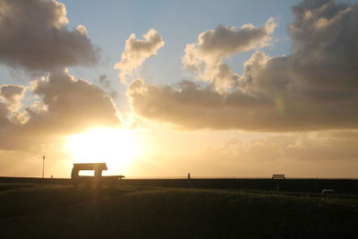 Silhouette landscape against sky during sunset