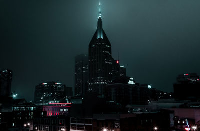 Illuminated buildings in city at night