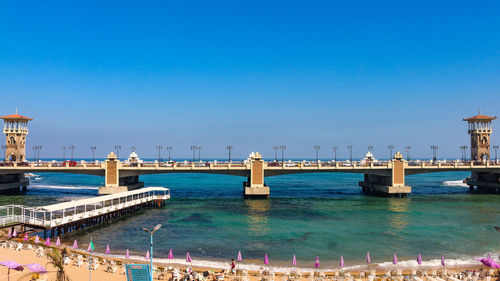 View of bridge over sea against blue sky