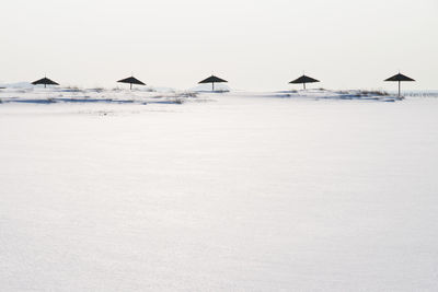 Scenic view of beach against clear sky