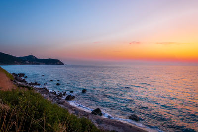 Scenic view of sea against sky during sunset