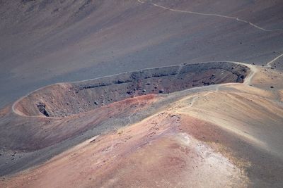 High angle view of tire tracks on road