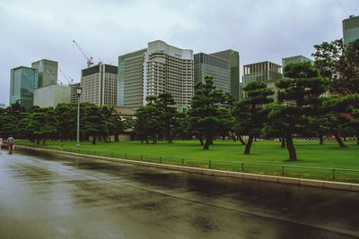 Buildings in city against sky