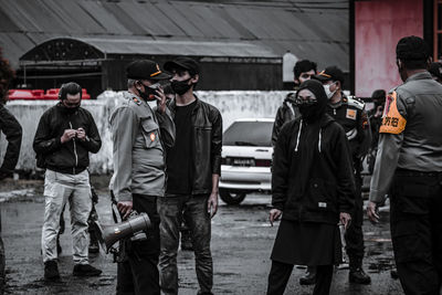 People standing on street in city