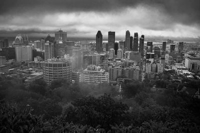 High angle view of buildings in city against sky