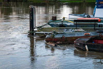 Boats moored in lake