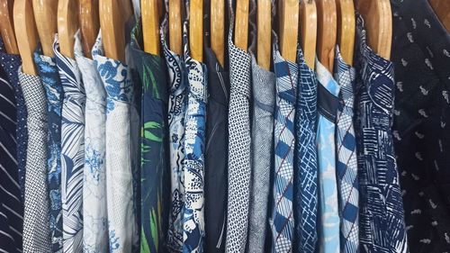 Close-up of clothes hanging at store