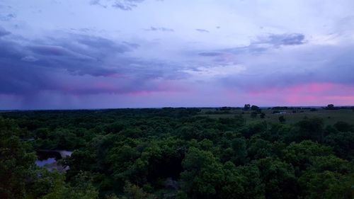 Scenic view of land against sky at dusk