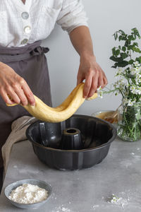 Midsection of man preparing food on table