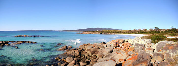 Scenic view of sea against clear blue sky