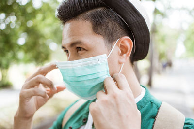 Close-up portrait of man drinking