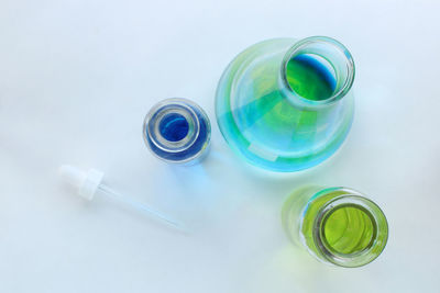 High angle view of glass bottle on table