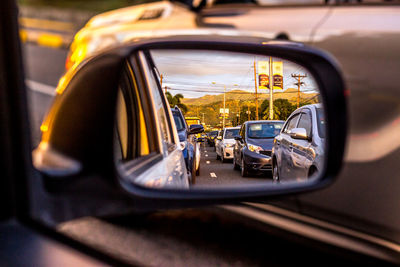 Reflection of cars on side-view mirror