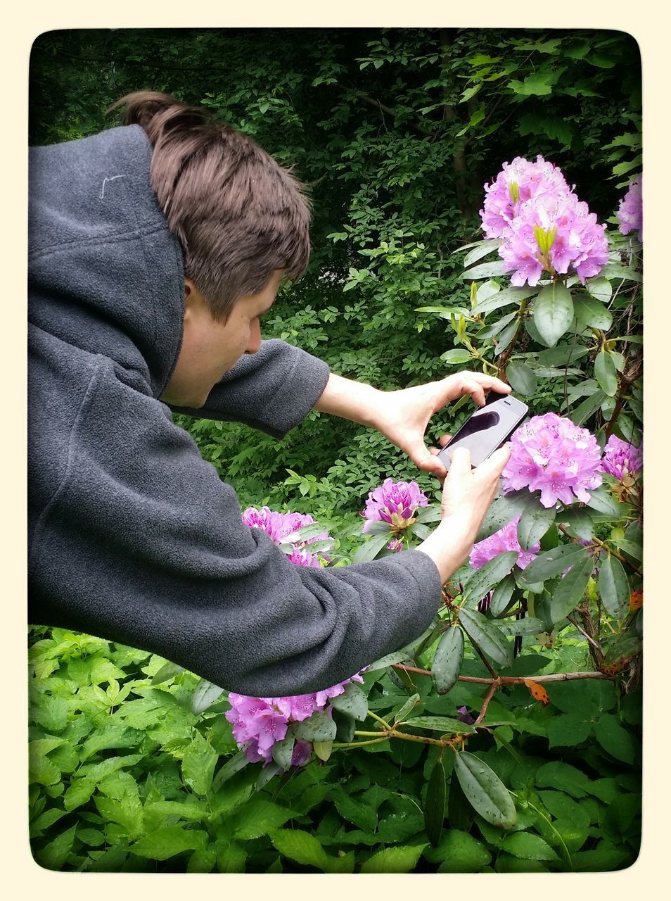 transfer print, flower, lifestyles, leisure activity, auto post production filter, casual clothing, field, sitting, person, fragility, plant, grass, bonding, low section, togetherness, relaxation, high angle view