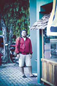 Full length portrait of man standing outdoors