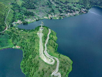 High angle view of the winding road by the lake