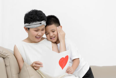 Happy couple holding heart shape