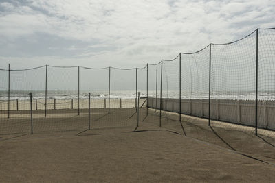 View of soccer field against cloudy sky