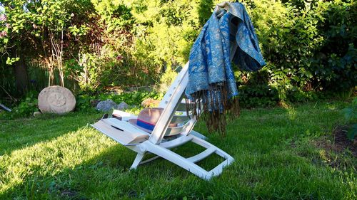 View of empty chair on grassy field