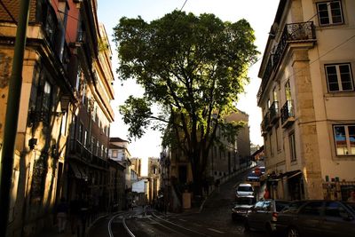 Street amidst buildings against sky