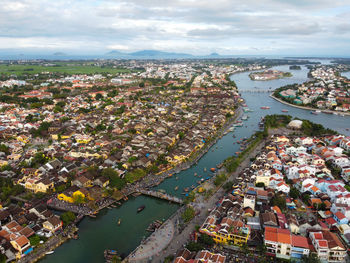 High angle view of river amidst buildings in city