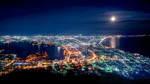 High angle view of cityscape illuminated at night