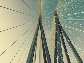 Low angle view of cables against sky