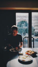 Man looking at view of restaurant