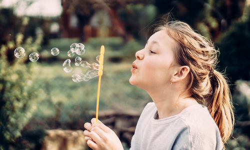 Girl looking at bubbles