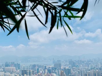 Panoramic view of buildings in city against sky