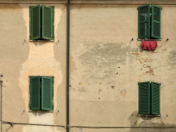 Low angle view of window on wall of building