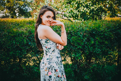 Young woman lying on grassy field