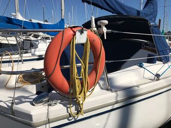 Sailboats moored in sea